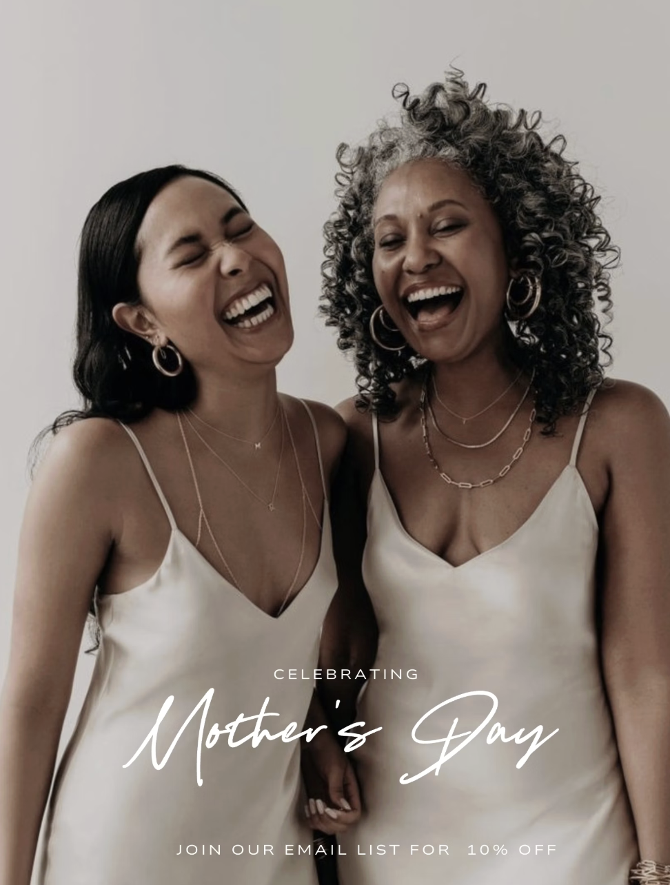 Two women laughing together — celebrating Mother's Day