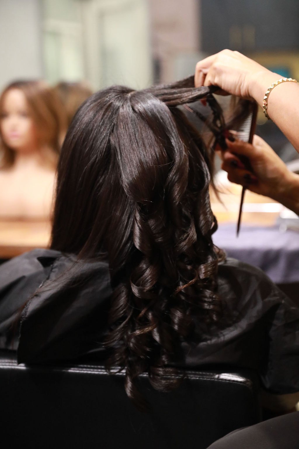 Hands working through hair at the root